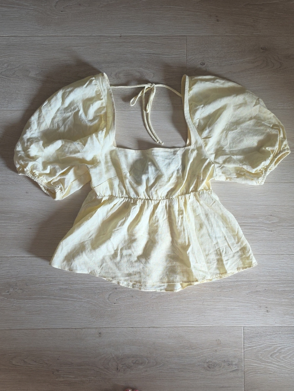 Divided Pale Yellow Puff Sleeve Tie-Back Peplum Top